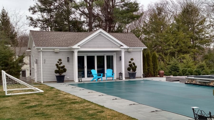 image of pool house with covered up inground pool